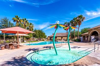 A pool with a blue water and a green pole in the middle.